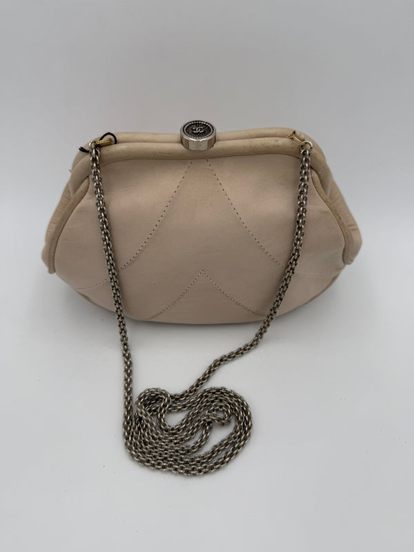 CHANEL - Clutch with hidden chain