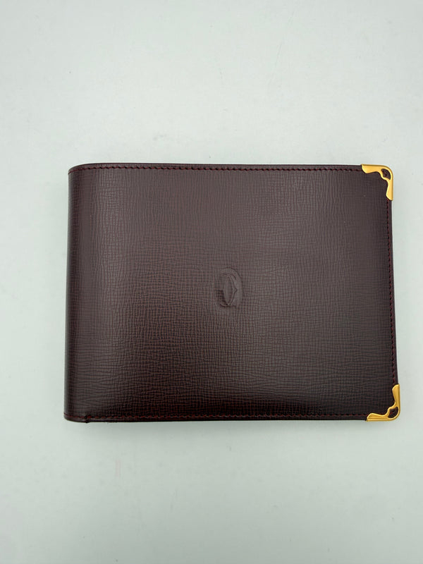 CARTIER - Portafoglio “Must de …” pelle granata